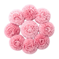 Overhead view of nine fluffy, light-pink, circular objects arranged in a flower-like pattern