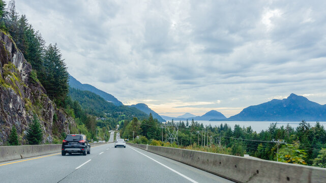 Howe Sound, BC, Canada with mountainous Gulf Islands on horizon at right, as seen from the Sea to Sky Highway, heading towards Vancouver.
