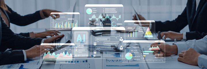 A modern office workspace showcasing a collaborative team examining AI-driven analytics and data visualization on screens, enhancing productivity and decision-making. Trope