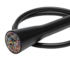 Close-up of a cut black cable revealing a dense bundle of colorful wires