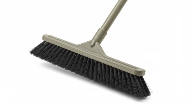 Closeup of a gray push broom with dark bristles isolated on white background