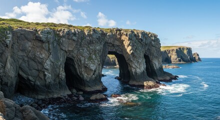 Naklejka premium Spectacular rock arch formation on the coast with ocean views on a sunny day