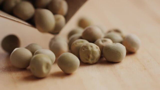 Dry seeds of peas for home vegetable garden etc. Assorted mix of varieties hence variation. Isolated on white background.