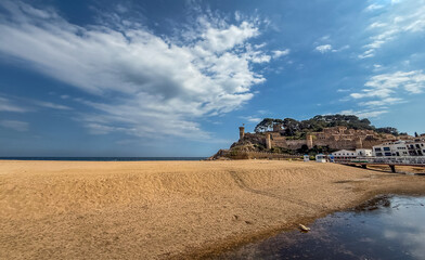 Tossa de Mar beach and the castle and its walls in the background. Girona, Spain