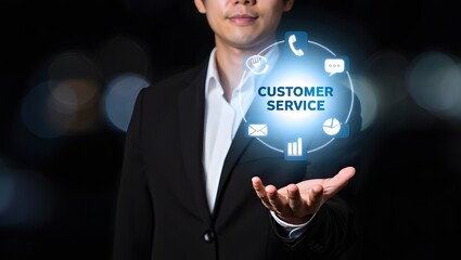 Businessman holding glowing sphere with customer service icons and text