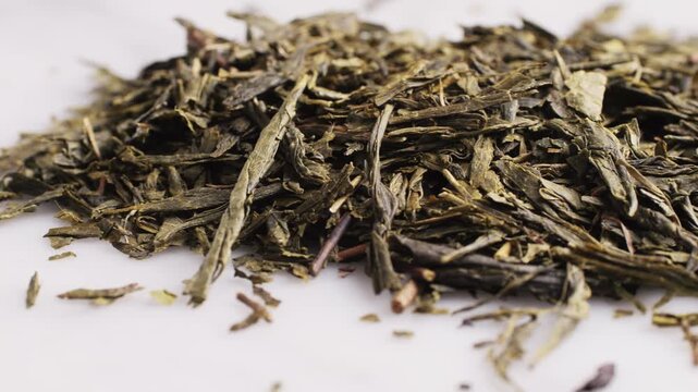 High quality Japanese Gyokuro sencha dried tea leaves close up in a tea tin