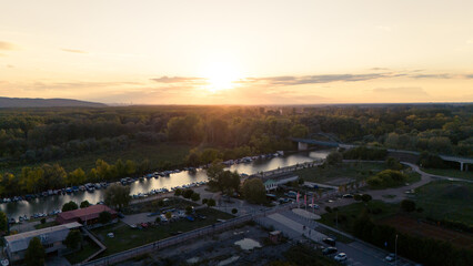 Pancevo, Serbia - 10 06 2025: Aerial shots of the town and river and city park and church