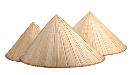 Three conical woven hats of varying sizes against a transparent background