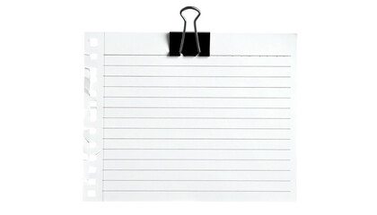 White ruled paper clipped at the top, with a black binder clip, against a black backdrop