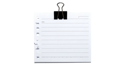 A lined white paper sheet clipped with a black binder clip, isolated on black background