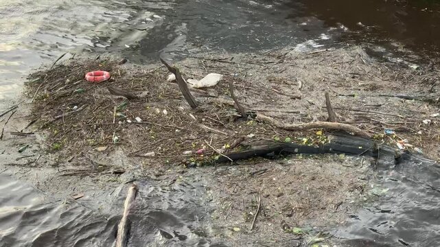 Rubbish floating on the River Clyde in Glasgow polluting the water