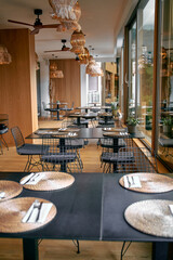 Elegant and Modern Dining Space with Stylish Decor and Natural Light for Inviting and Memorable Culinary Experiences