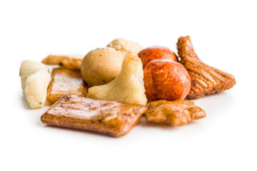Salted snack. Coated peanuts and mini crackers isolated on white background.
