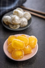 Japanese mochi dessert on plate on black table.