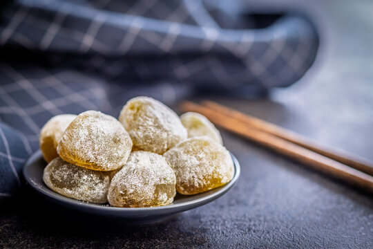 Japanese mochi dessert on plate on black table. - Powered by Adobe