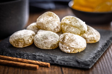Japanese mochi dessert on plate on wooden table.