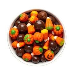 Overhead shot of a white bowl brimming with assorted festive Halloween candies