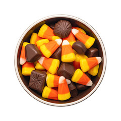 Overhead shot of a ceramic bowl filled with candy corn and chocolate candies
