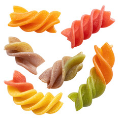 Close-up view of multi-colored spiral pasta pieces on a black background