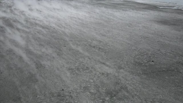 Aerial view of the vast salt evaporation ponds showing the movement of wind and salt crystals, Jawa Timur, Indonesia.