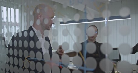 Young professionals collaborate on a project in a modern startup office, brainstorming ideas and strategizing for success.