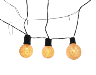 Overhead shot of three decorative, warm-lit globe string lights, black wire, against black background