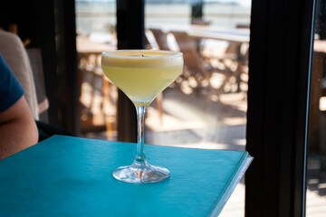 pisco sour cocktail drink in a seaside restaurant in Uruguay