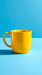 A vibrant yellow mug on a bright blue background