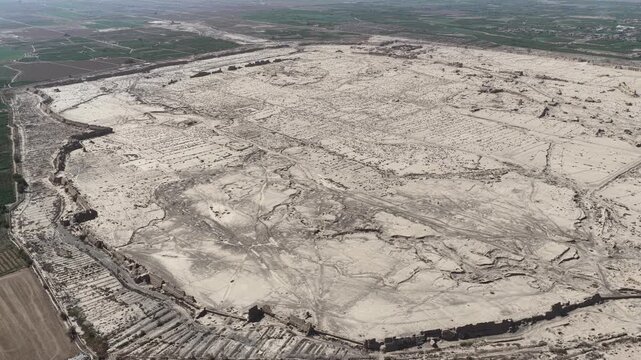 Aerial view of Gaochang Ancient Town, its intricate layout etched in the arid landscape, revealing history and culture through the textures of the ancient ruins, Gaochang, China.