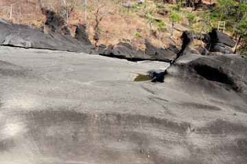 The unusual dark rock formation at the Vale da Lua in Chapada dos Veadeiros near the city of Alto Paraiso, Brazil