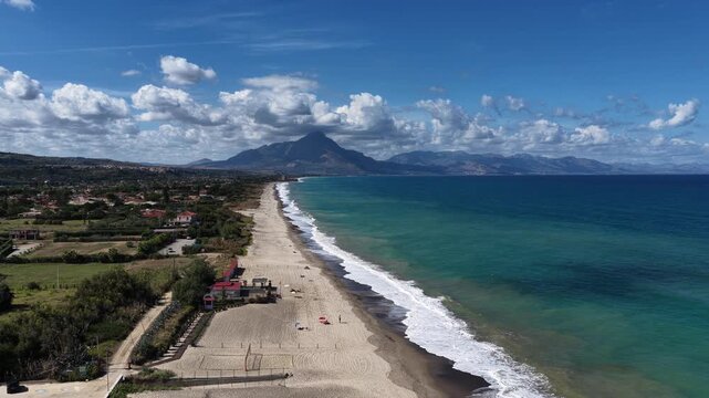 Aerial drone view of Campofelice di Roccella, a charming Sicilian seaside village in northern Sicily, Italy, showing traditional holiday homes, coastline, and panoramic Tyrrhenian Sea vistas