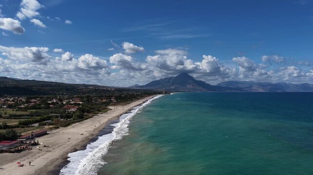 Aerial drone view of Campofelice di Roccella, a charming Sicilian seaside village in northern Sicily, Italy, showing traditional holiday homes, coastline, and panoramic Tyrrhenian Sea vistas