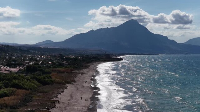 Aerial drone view of Campofelice di Roccella, a charming Sicilian seaside village in northern Sicily, Italy, showing traditional holiday homes, coastline, and panoramic Tyrrhenian Sea vistas