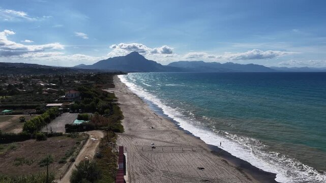 Aerial drone view of Campofelice di Roccella, a charming Sicilian seaside village in northern Sicily, Italy, showing traditional holiday homes, coastline, and panoramic Tyrrhenian Sea vistas