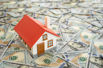A house built on dollar bills. Housing and square footage prices. Expensive land and real estate....