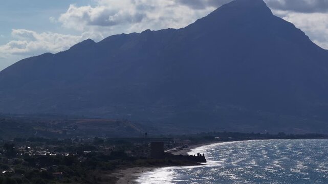 Aerial drone view of Campofelice di Roccella, a charming Sicilian seaside village in northern Sicily, Italy, showing traditional holiday homes, coastline, and panoramic Tyrrhenian Sea vistas