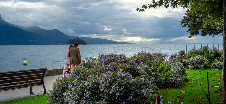 Couple Walking in rainy day in Vevey by Geneva lake Under Umbrella