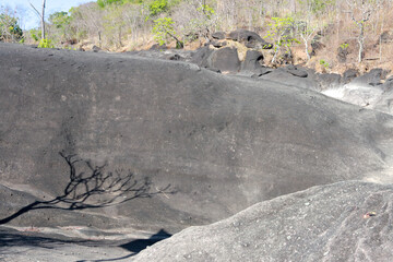The unusual dark rock formation at the Vale da Lua in Chapada dos Veadeiros near the city of Alto Paraiso, Brazil