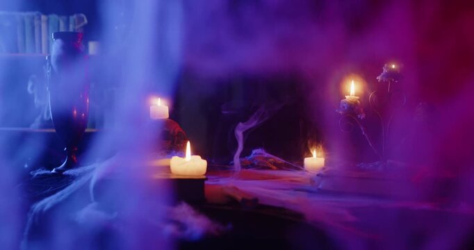Eerie Halloween Scene with Glowing Candles and Smoke