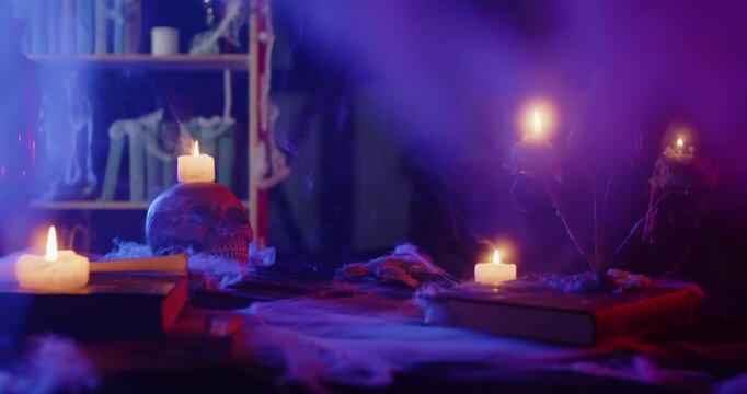 Eerie Halloween Scene with Glowing Candles and Smoke