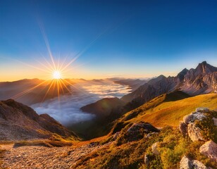 Obraz premium breathtaking sunrise over majestic mountain peaks with vibrant sun rays and soft fog in valley below