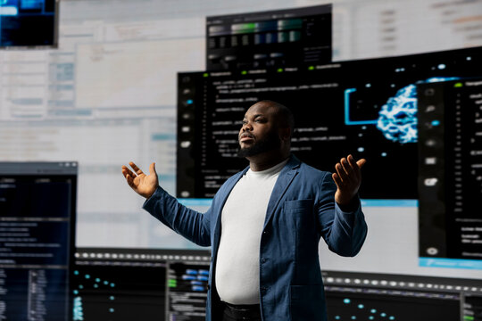 Black professional software engineer programming for tech innovation, reviewing data and binary code on the dashboard. IT specialist examining programming language code for transformation.