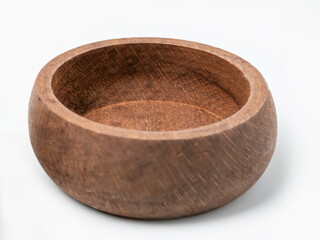 Handcrafted rustic wooden bowl on white background for kitchen or home decor