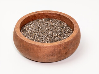 Chia seeds in a wooden bowl on white background for healthy eating concept