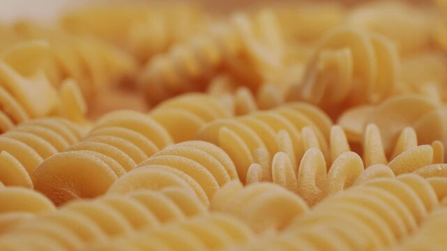 Pasta mix, different Italian tagliatelle fussili pasta packaging window, Fettuccine pasta, close up, not cooked