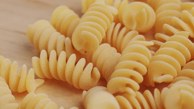 Pasta mix, different Italian tagliatelle fussili pasta packaging window, Fettuccine pasta, close up, not cooked