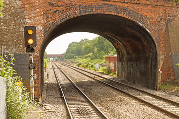 A road bridge over the main line from London to Bristol at Twyford station looking east with the railway lines disappearing into the distance