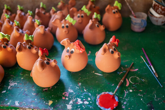 Clay piggy banks in pottery workshop