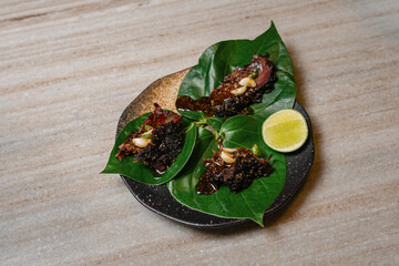 Thai Northern dish Miang Nua (spicy beef wrapped in leaves)