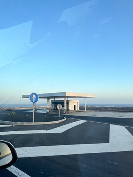 modern gas station located on an empty highway roundabout.